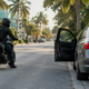 Miami motorcycle dooring accident scene with an open car door beside a motorcyclist
