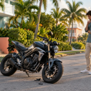A rider reviews a damaged motorcycle in a Miami motorcycle total loss value dispute